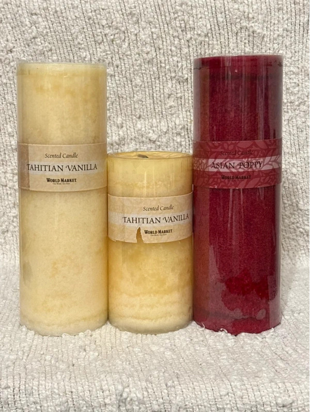 World Market Asian Poppy/Tahitian vanilla Pillars. (2) 9 inch and (1) 6 inch